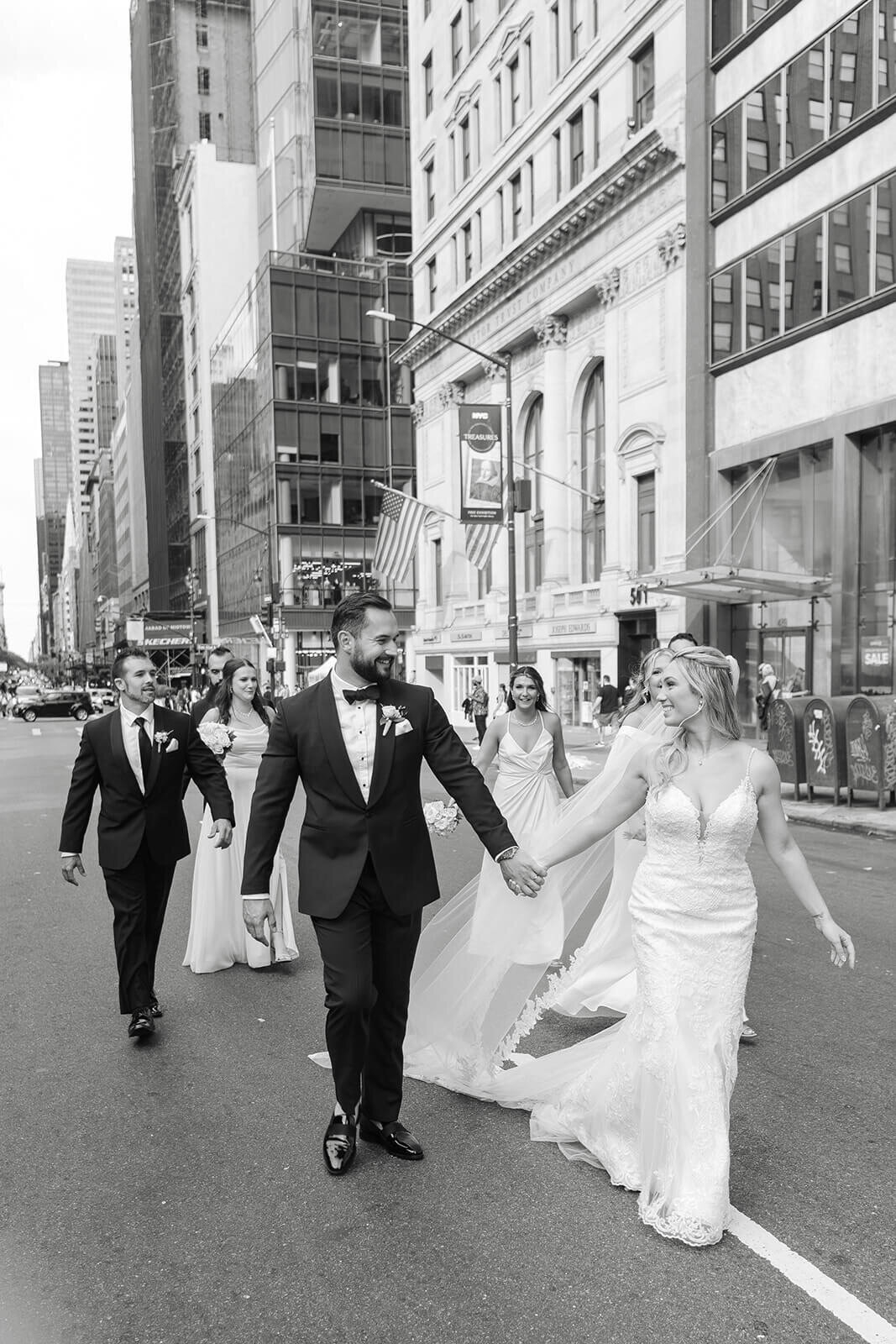 Bride and groom walking through New York City