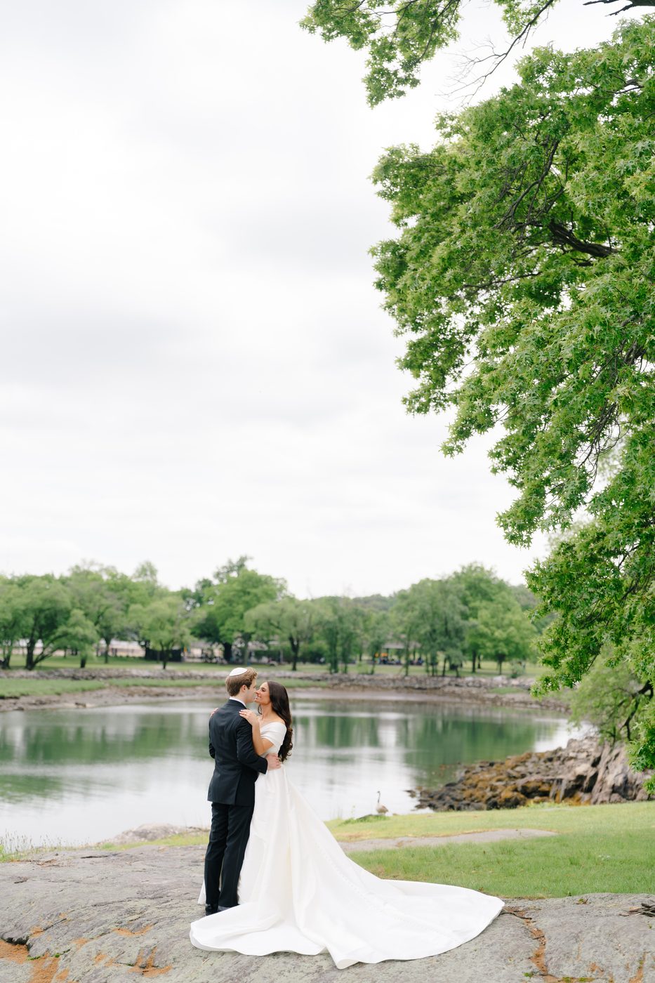 Wedding at Glen Island Harbour Club — couple rock lagoon glen island