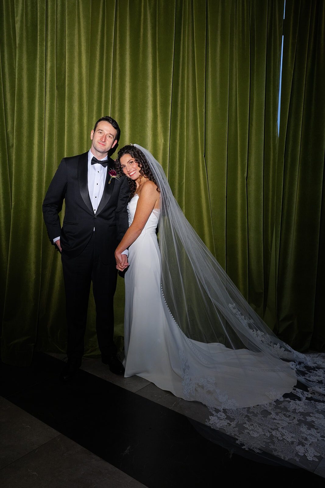 Portrait in front of the green velvet curtain at Hudson House