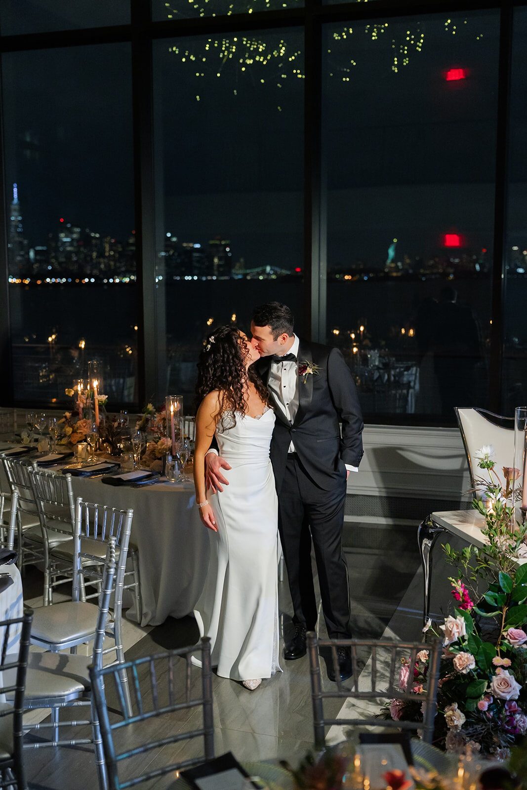 The ballroom windows with the city lit up at night