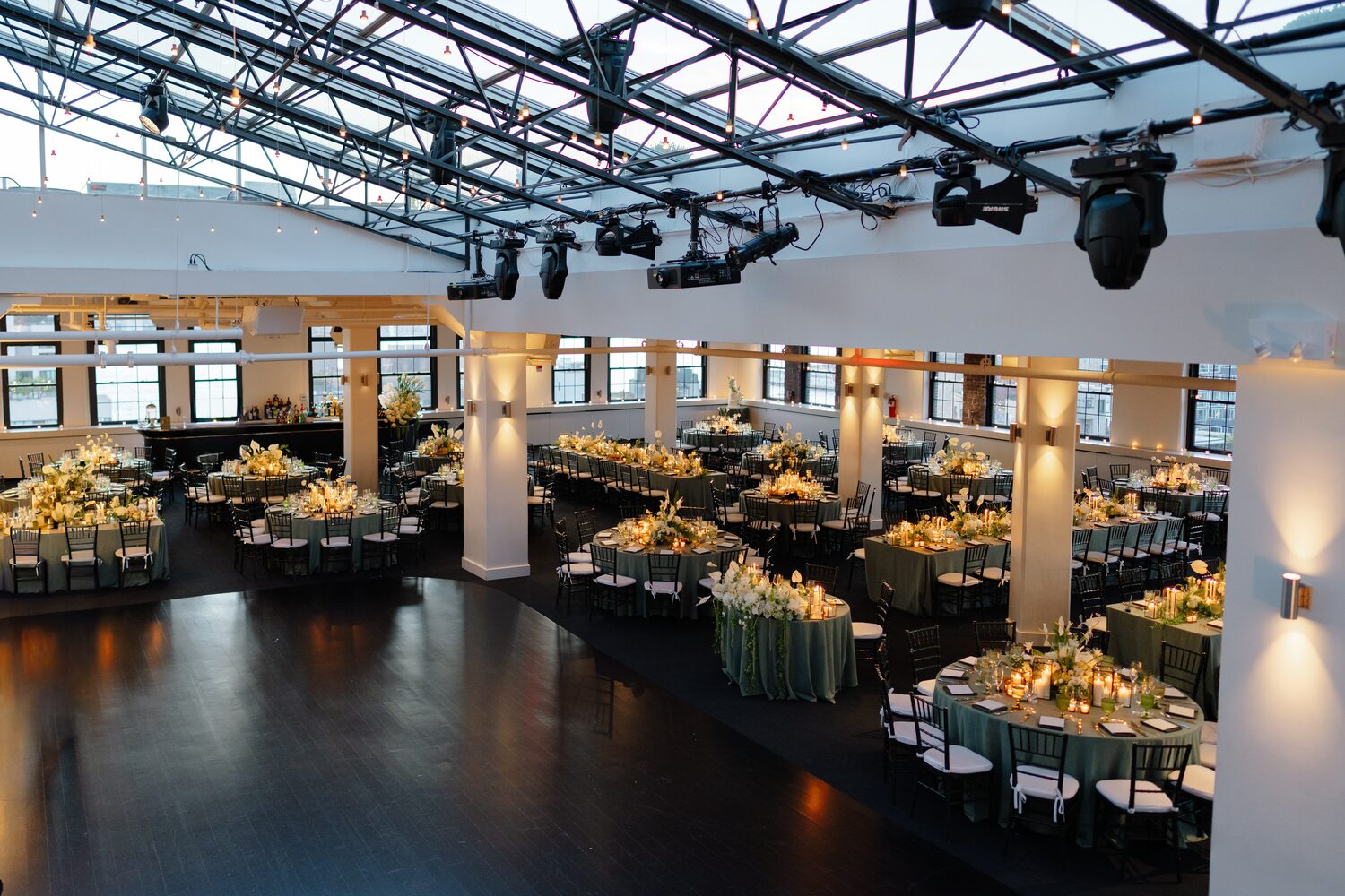 Wedding at Tribeca Rooftop + 360° — reception room glass roof amber light